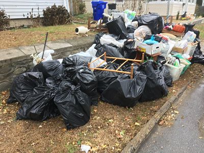 bags of trash & junk to be picked up curbside in long beach california